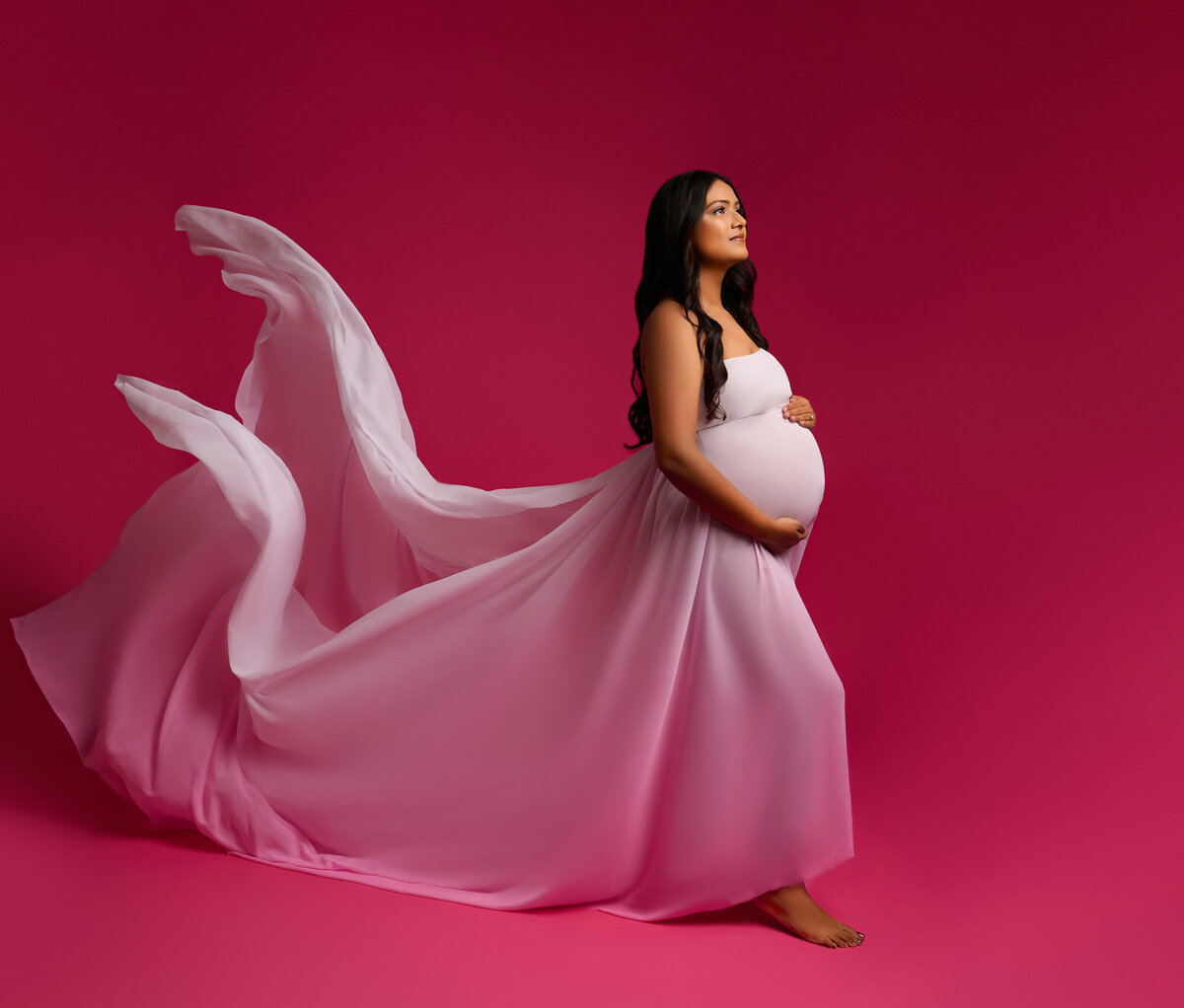 Elegant maternity photography with flowing gown by Spanish Oaks maternity photographer