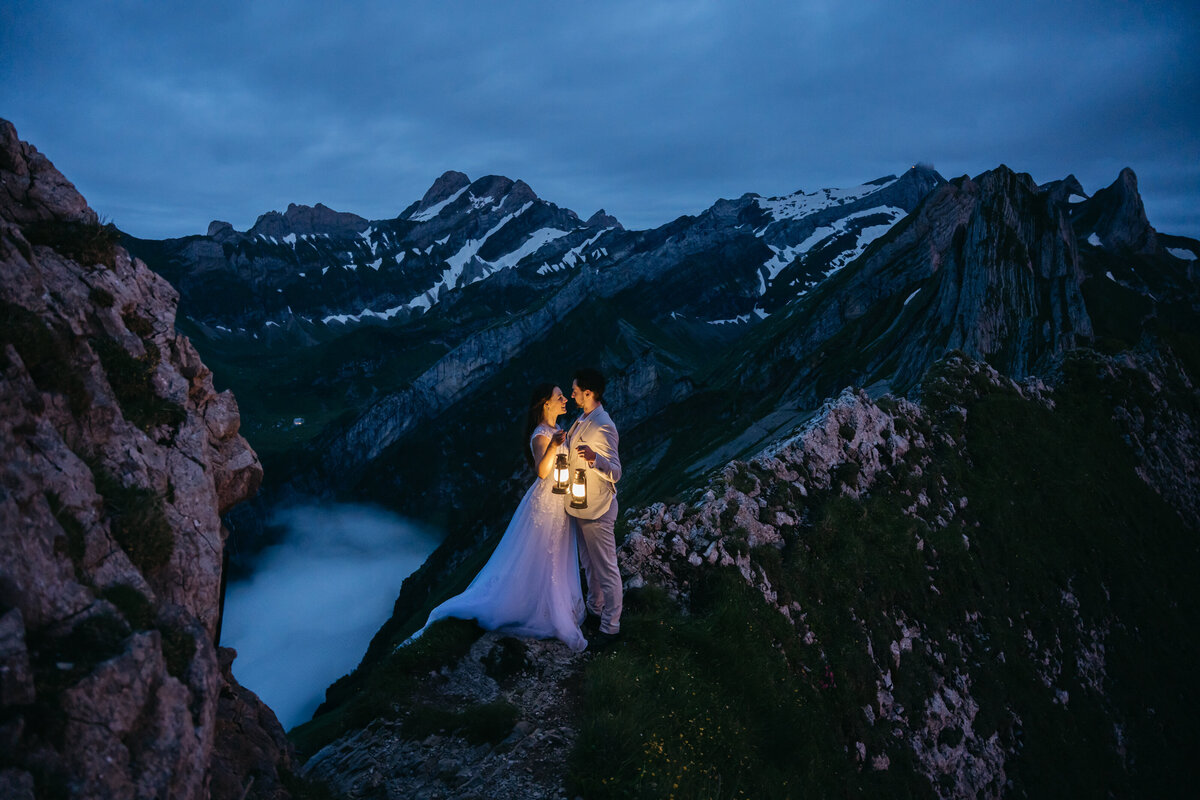 Couple using lanterns to see after dark during their elopemenet