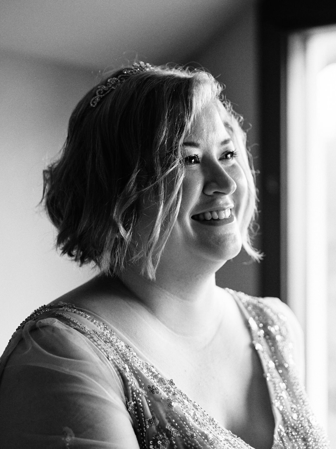 Bride smiles during wedding ceremony.