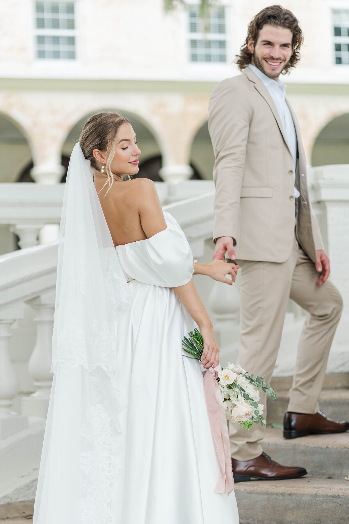 wedding couple going up stairs