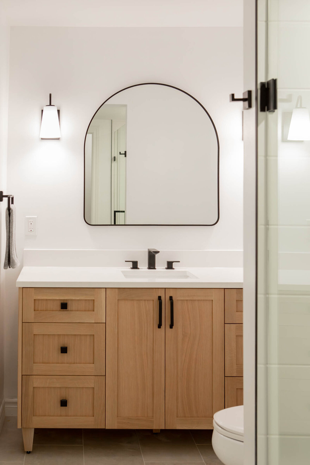 curved-mirror-wood-vanity