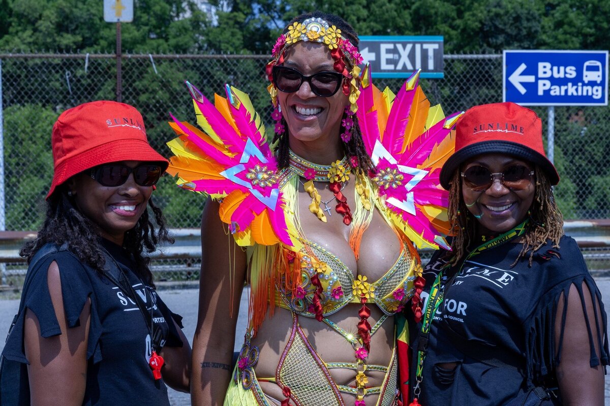 Toronto caribbean carnival parade masquerader in costume with Sunlime Mas, the number 1 medium size band at Toronto Carnival.