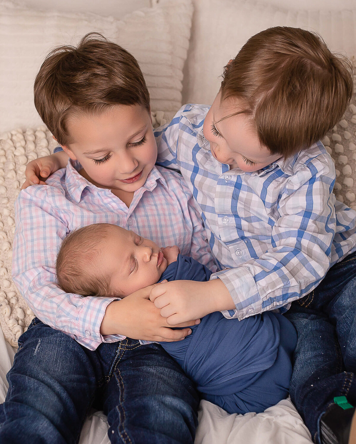 Cleveland Canton newborn photographer sibling pose.