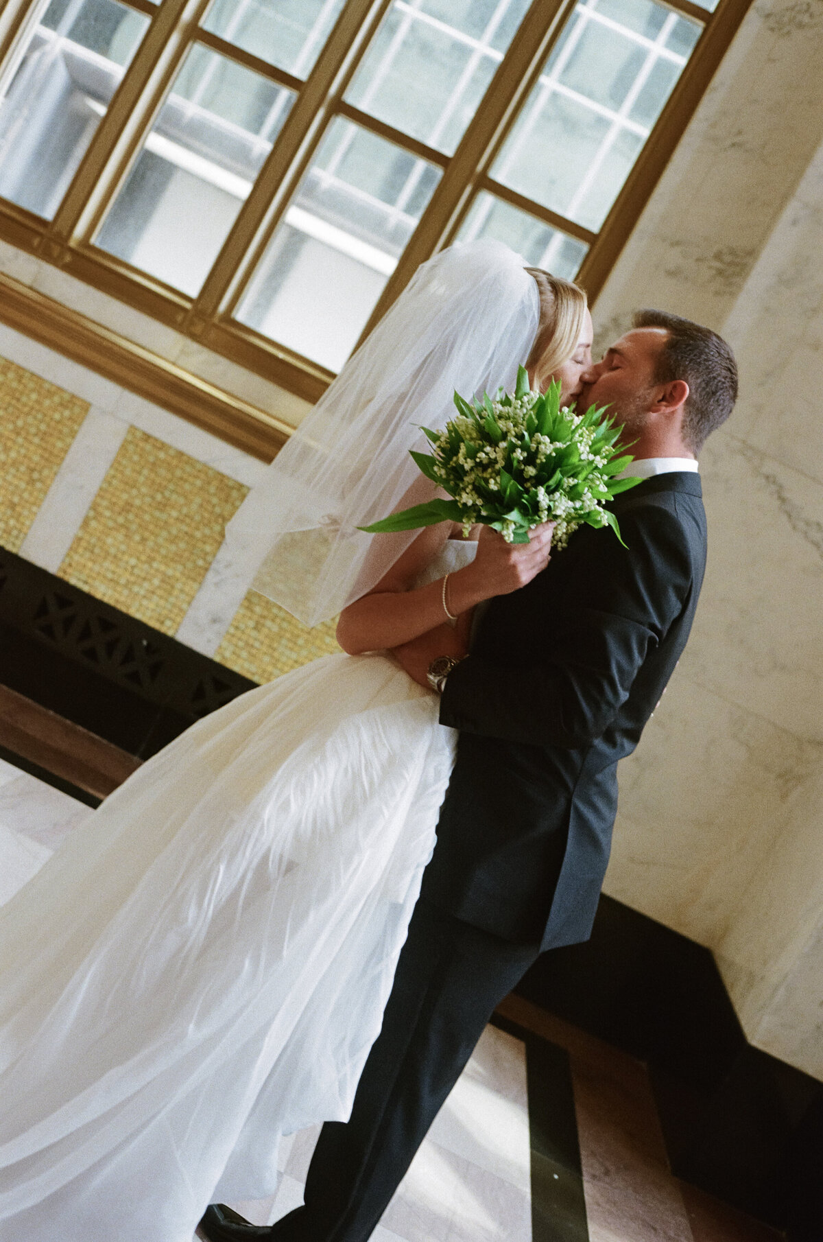Sophisticated editorial wedding photography captures ceremony moments at Old Post Office Chicago, showcasing Lauren Alatriste's luxury wedding approach combining architectural grandeur with fashion forward styling in magazine-worthy imagery.