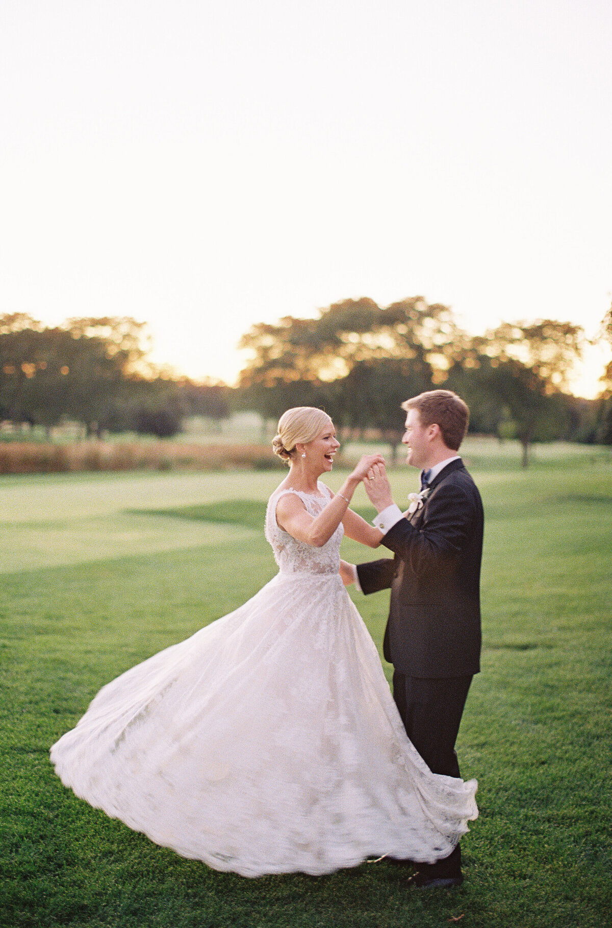 Bride and groom having a dance on the property at the Onwentsia country club. 