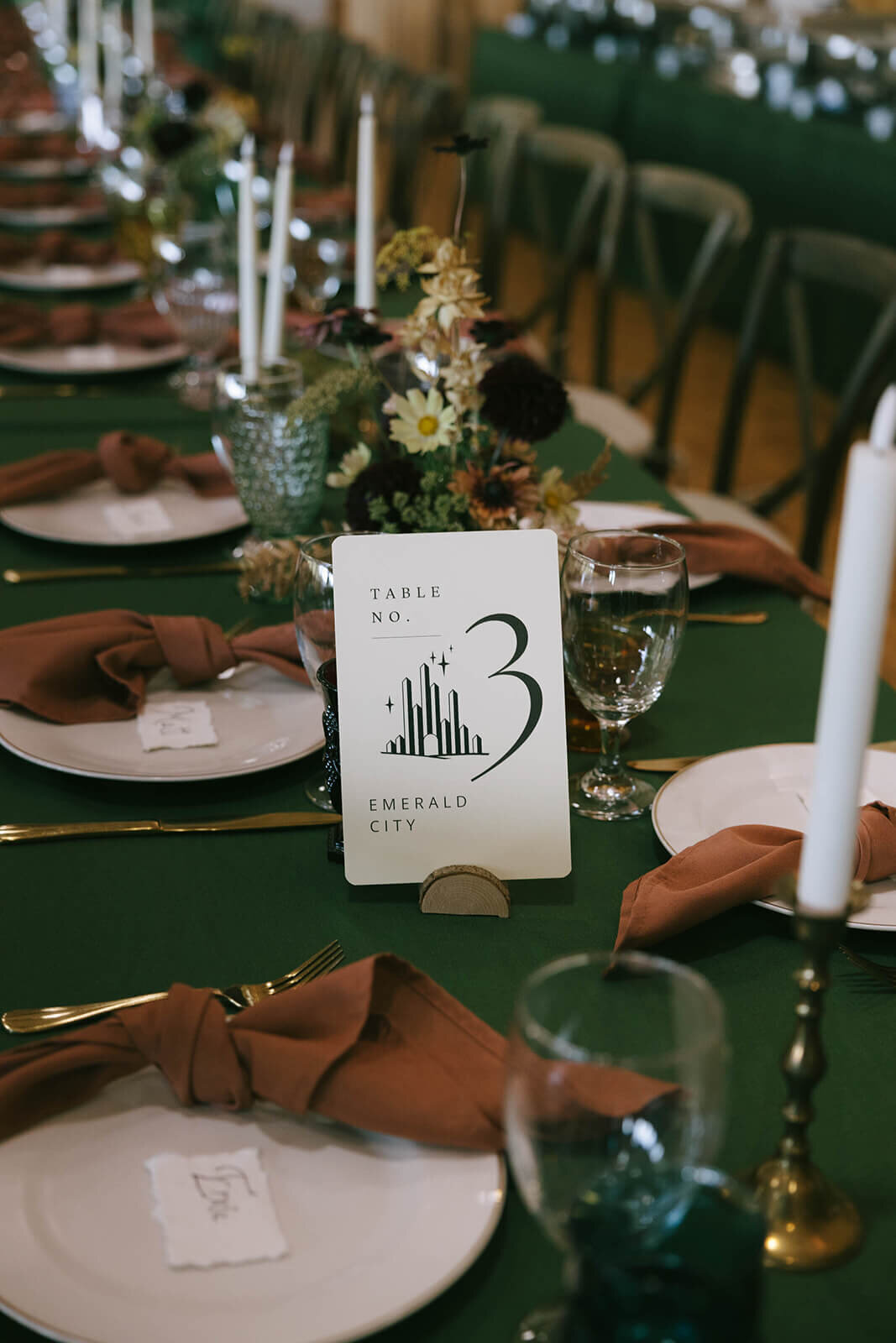 Wedding table details, including table number, tableware, and candles.