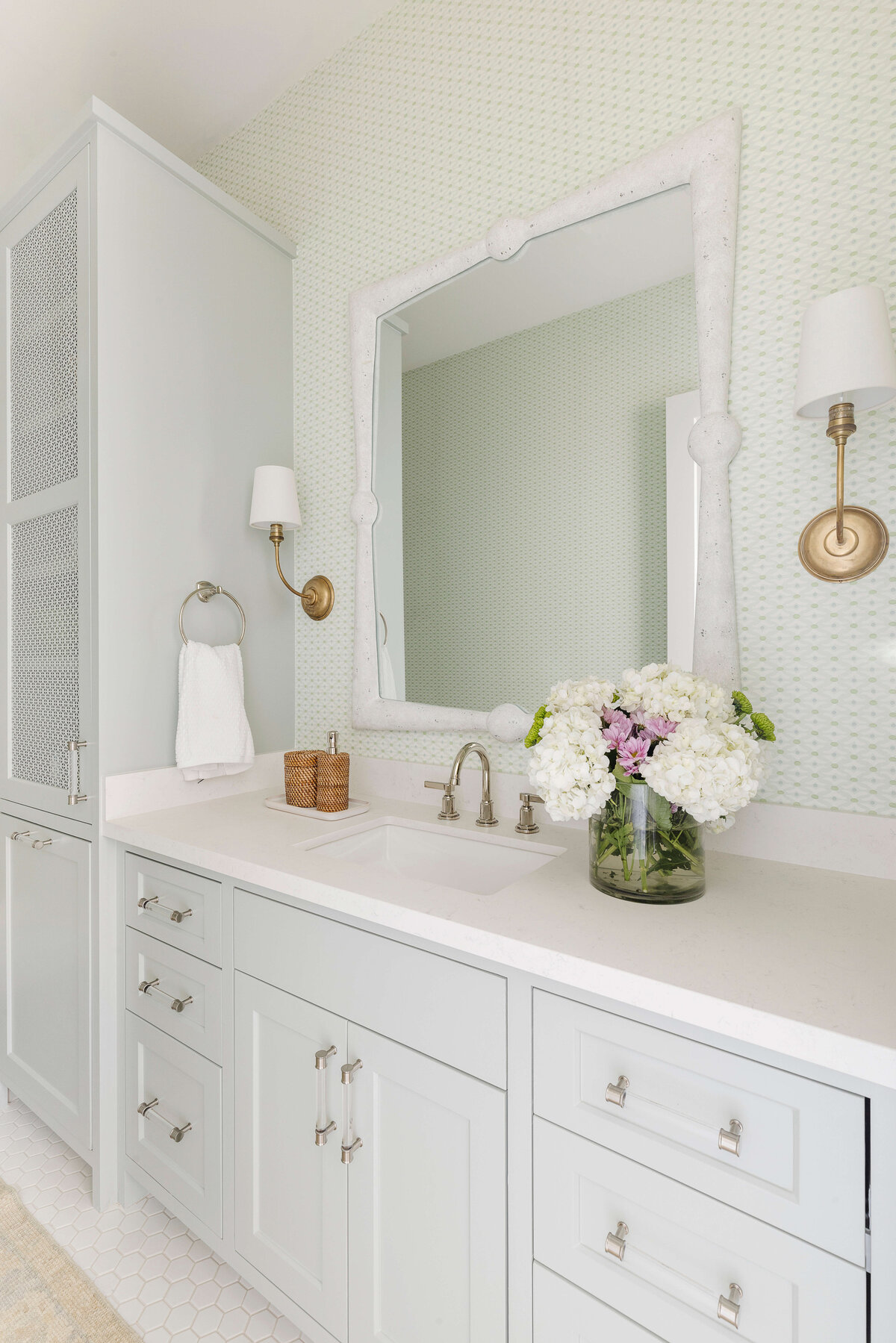 oyster creek studios missouri city new build white vanity with white counters and fresh flowers in bathroom