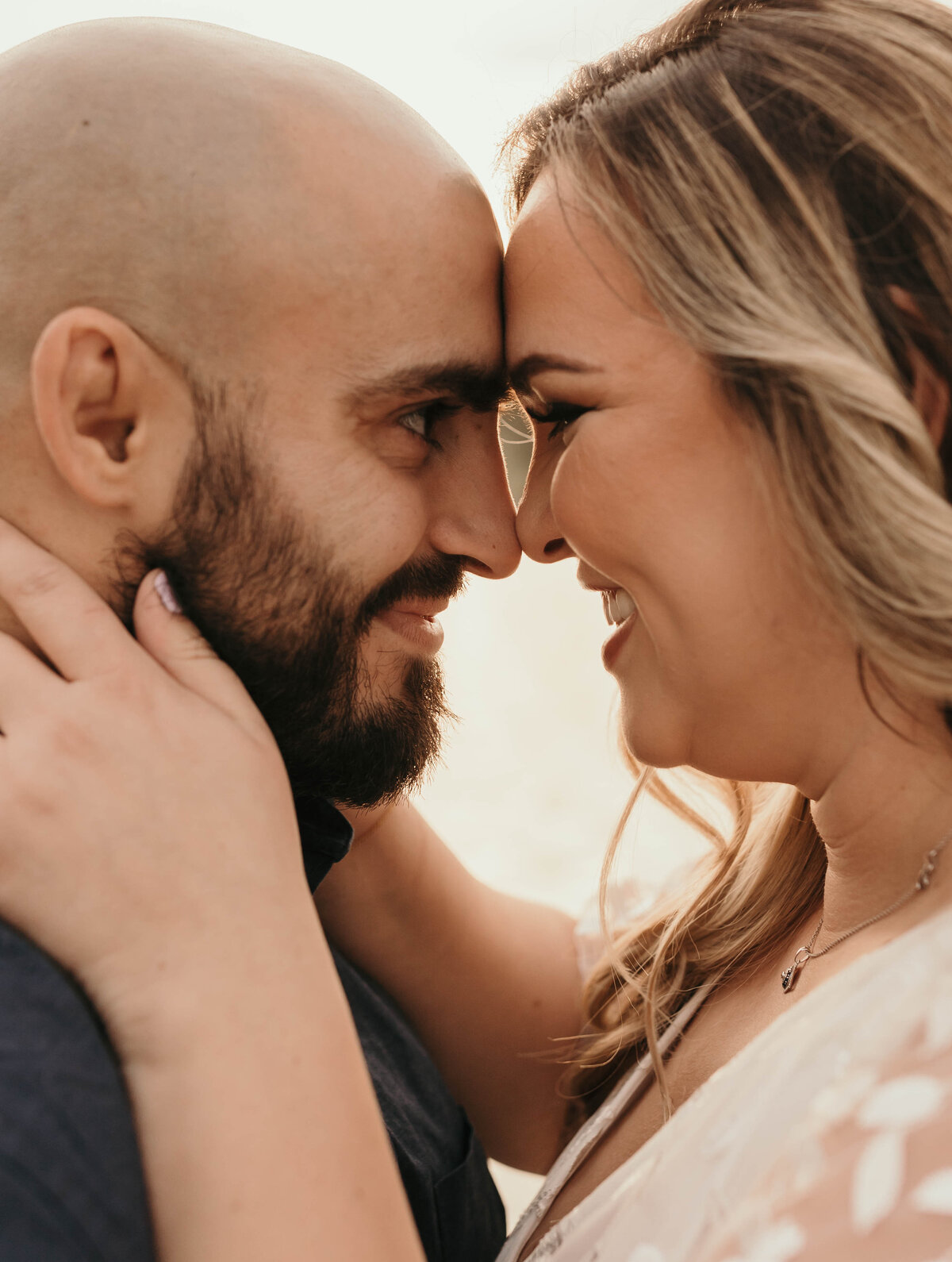 couple face to face engagement photos