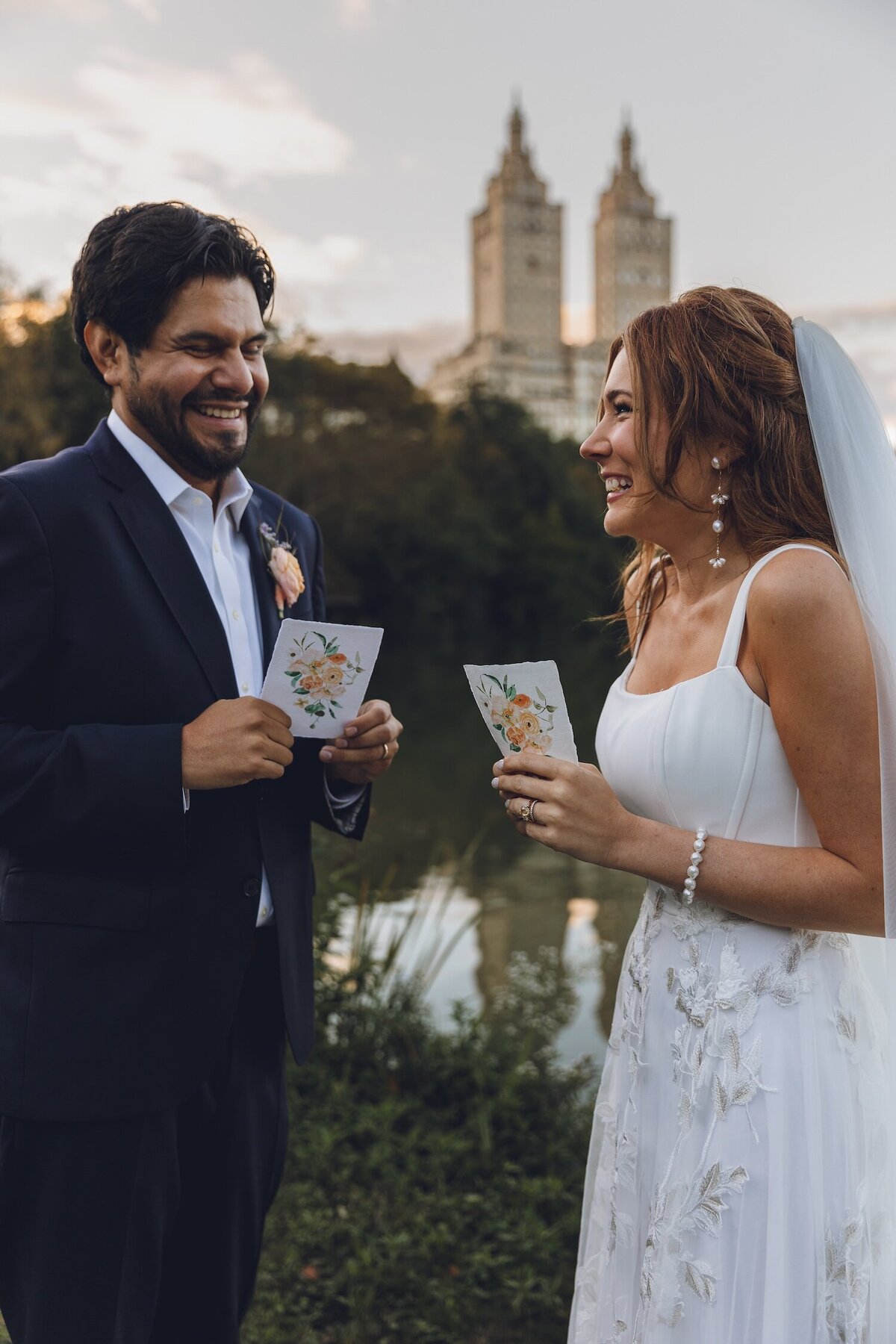 Couple exchanging vows beside the lake at sunset