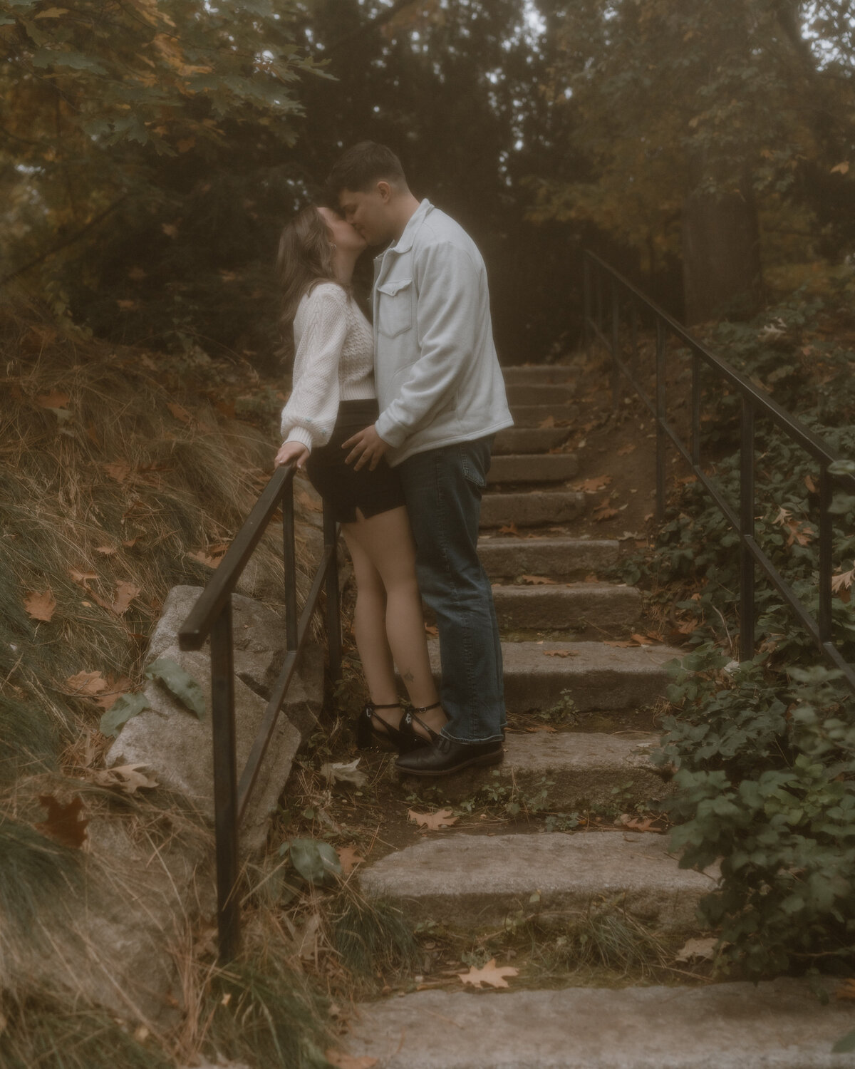An adventurous couple hikes through scenic Washington landscapes, capturing an engagement session filled with exploration and love.
