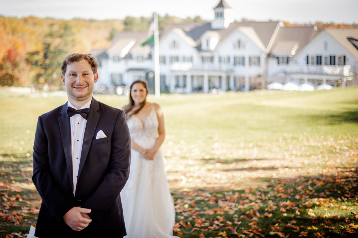 Photograph of a bride and grooms first look on a country club in fairfield connecticut.