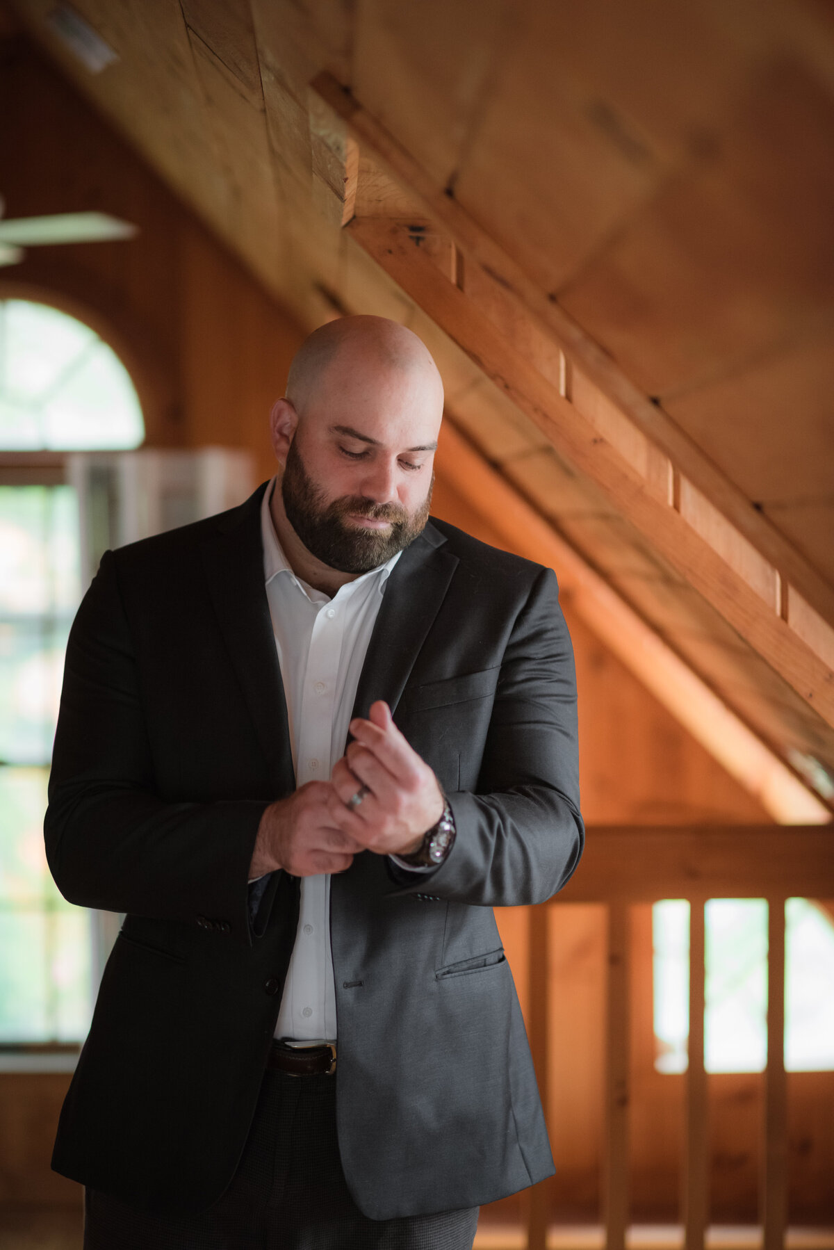 groom adjusting his cufflinks