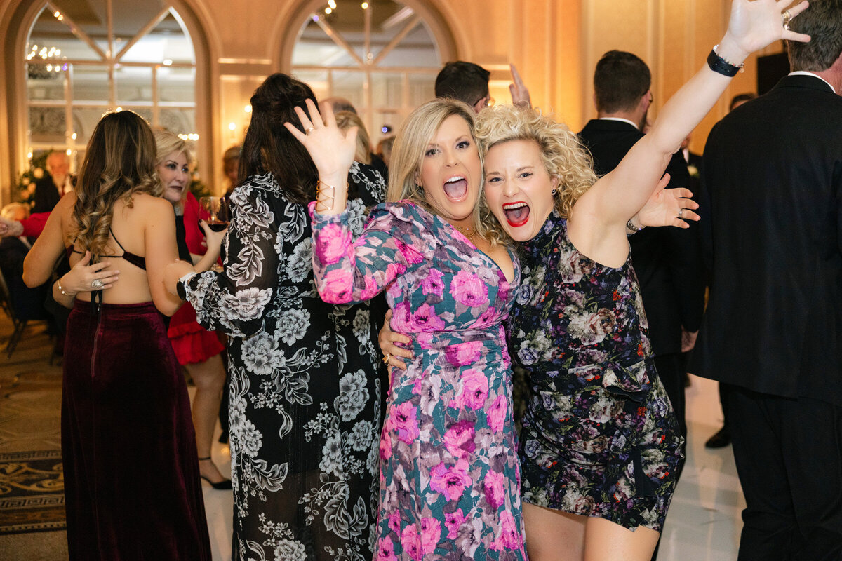 photo of the guests on the dance floor having fun at the wedding reception at The Adolphus in Dallas
