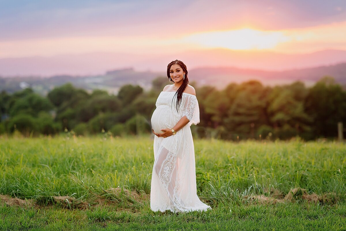 Maternity photography at sunset with mountain view