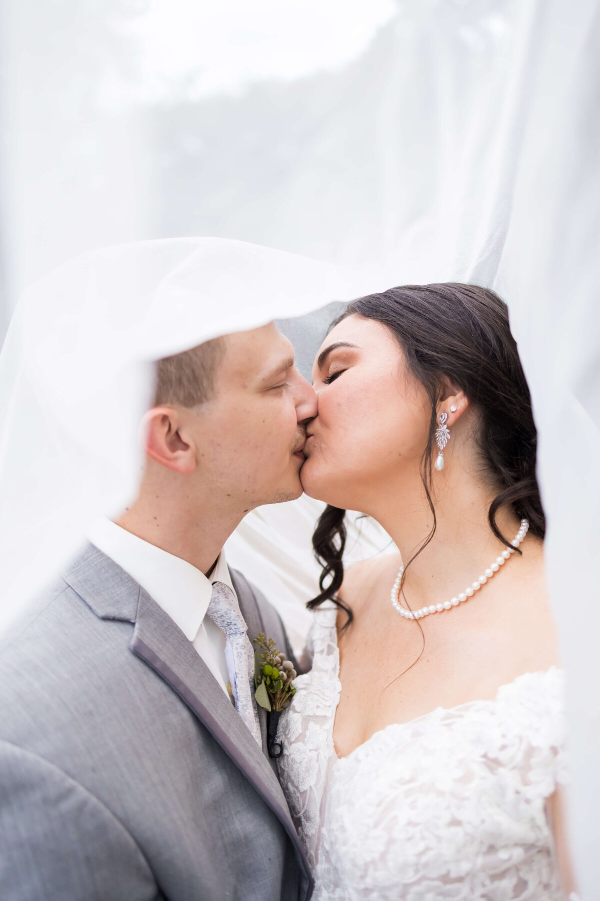 Bride and groom kissing at wedding at Mahr Park, Tennessee