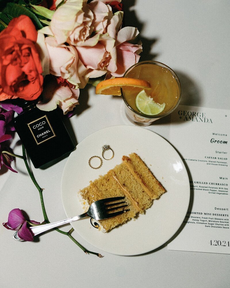 wedding cake slice with rings and details at penthouse at riverside wharf photos