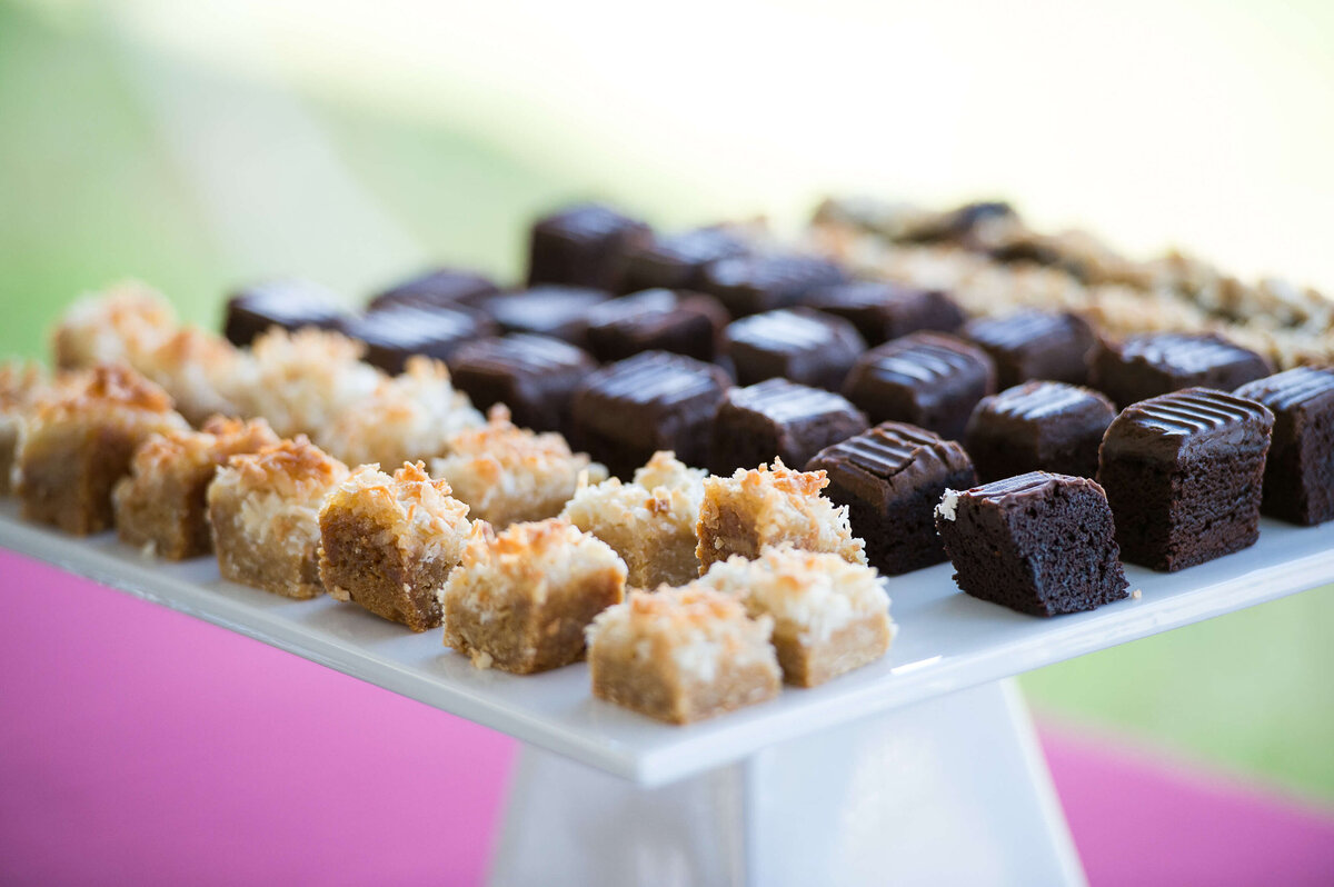 Ottawa event photos showing dessert bars on a tray that will be served to guests at a corporate anniversary celebration.  Captured by JEMMAN Photography COMMERCIAL