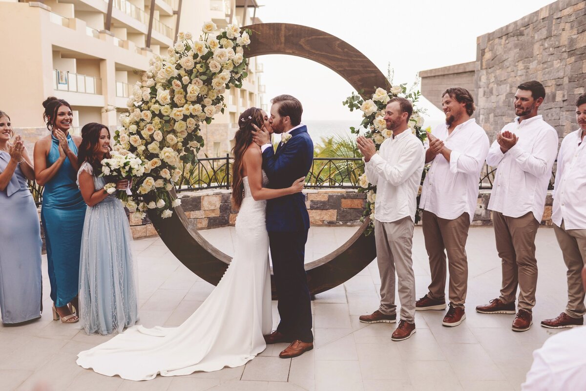 Bride and Grooms first kiss at wedding in Cancun