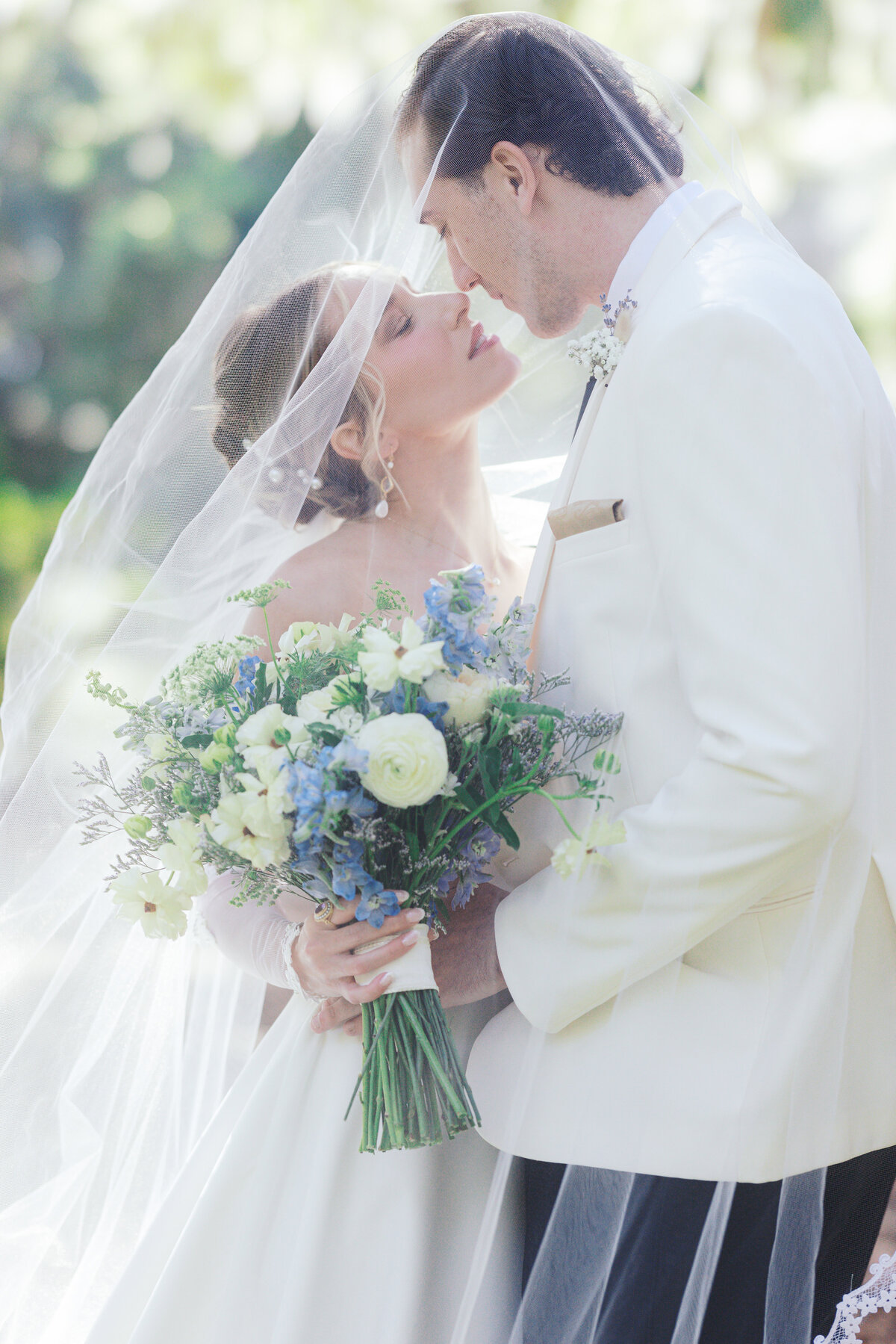 Bride and groom under the veil during wedding portraits in Charleston SC