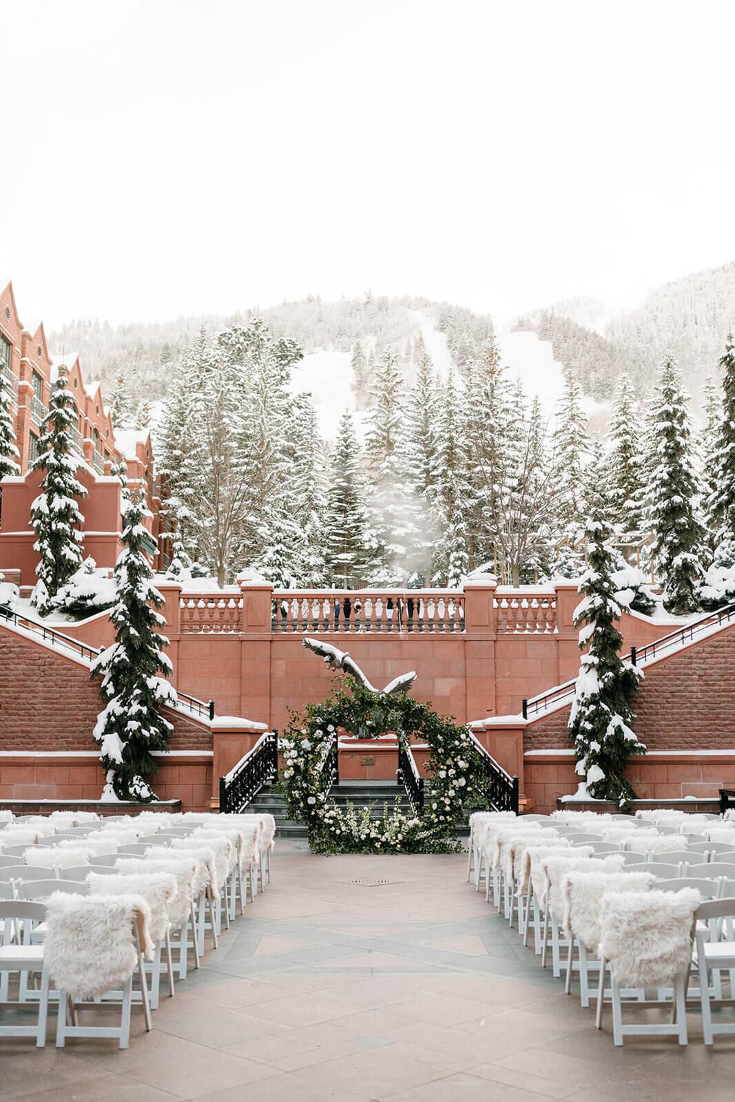 Stunning snow draped view of the outdoor wedding ceremony site at Aspen St. Regis.