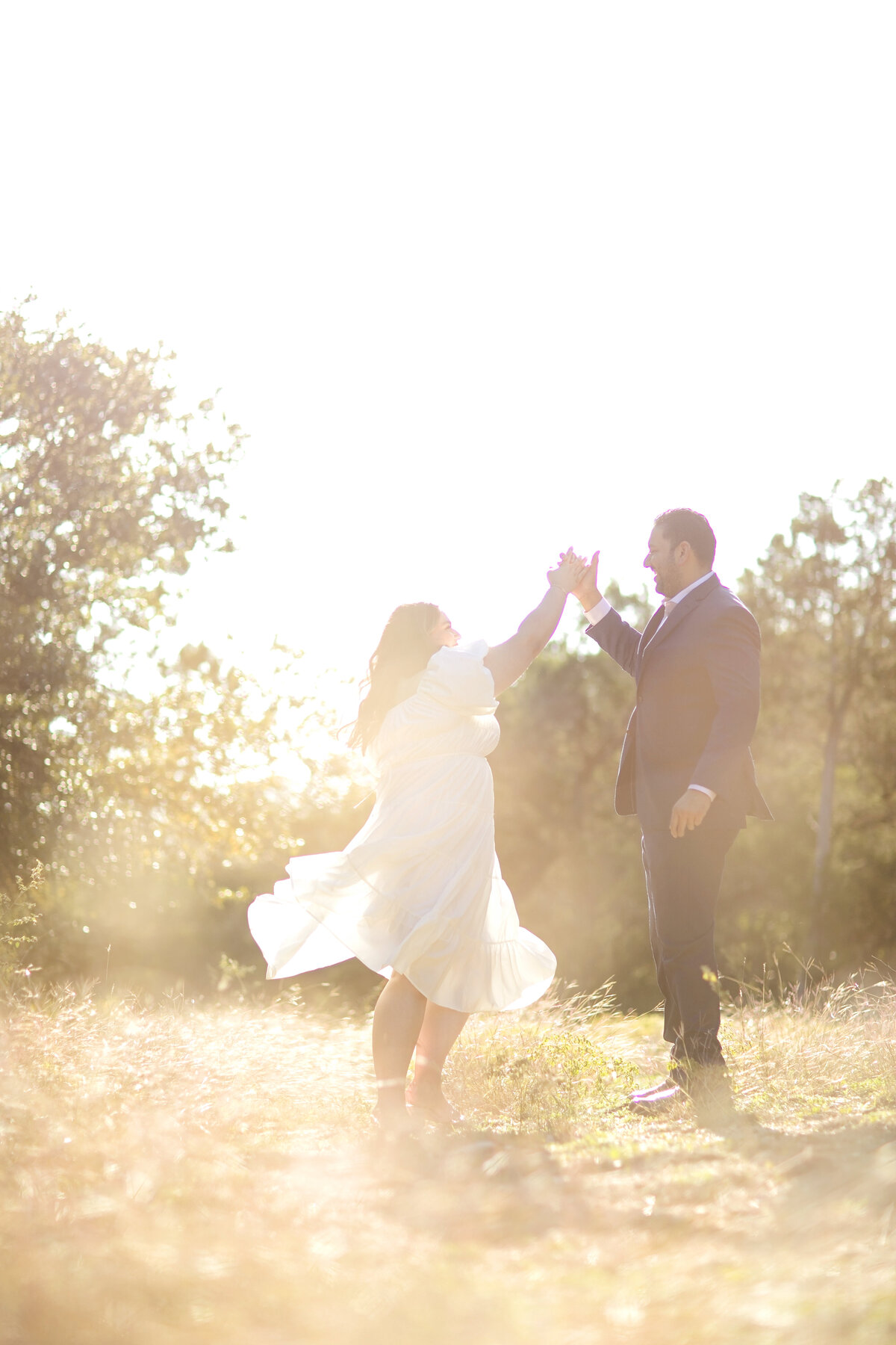 golden hour photography-dancing in field-engagement-texas engagement-san antonio texas-government canyon-robin rogers photography