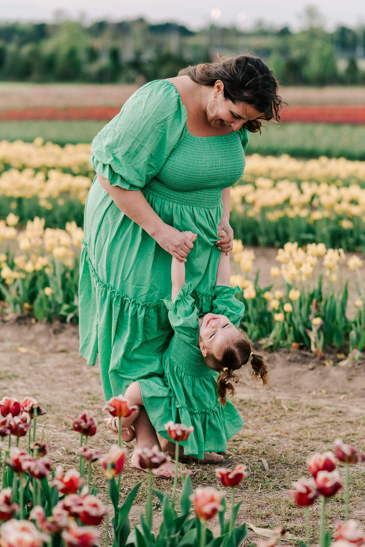 A mother having a special moment with her daughter in matching dresses at Burnside Farms