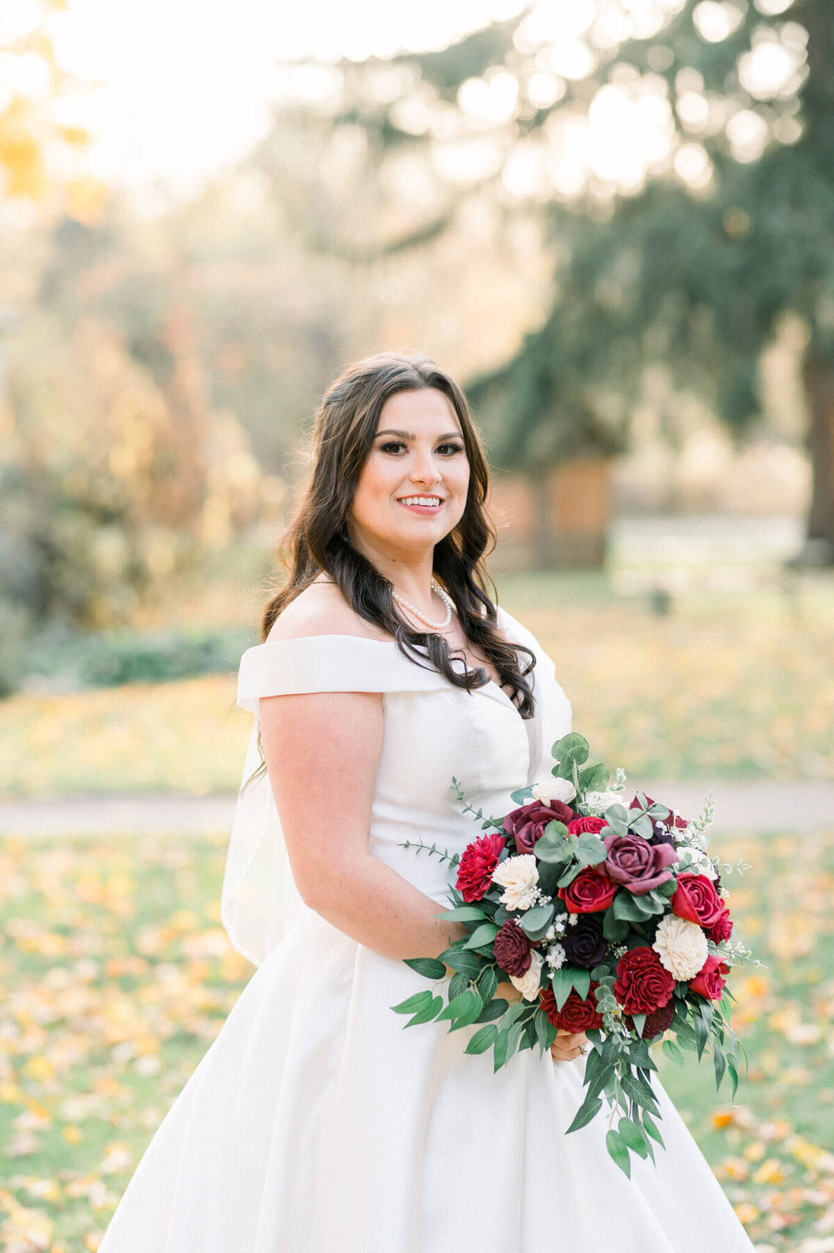 Bride holding flowers for her solo wedding portrait