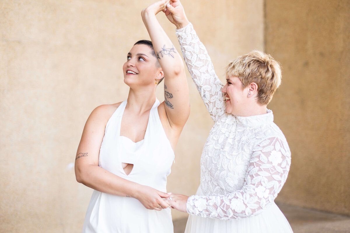 Brides wearing white outfits at LGTBQ wedding in Centennial Park, Nashville,TN