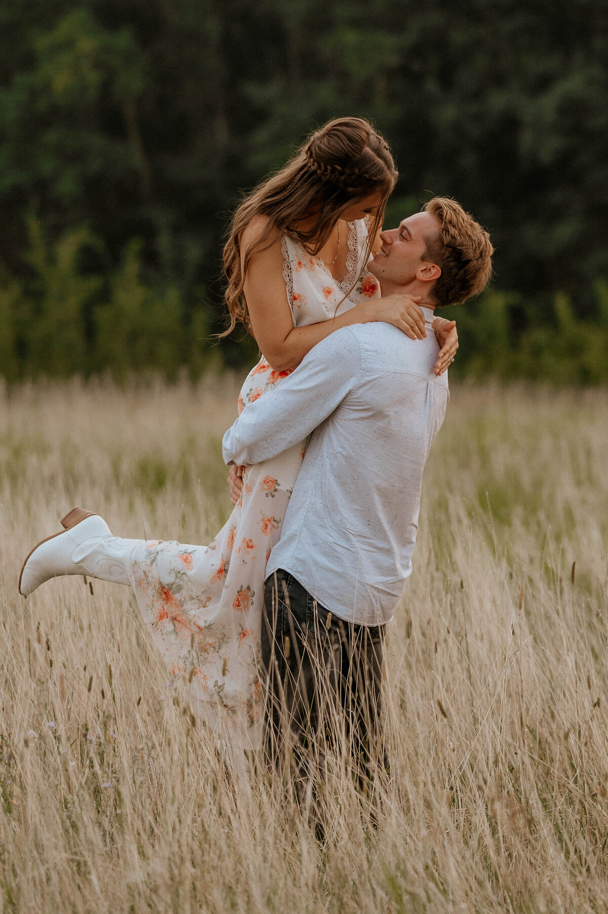 Engaged couple photographed in Alberta field