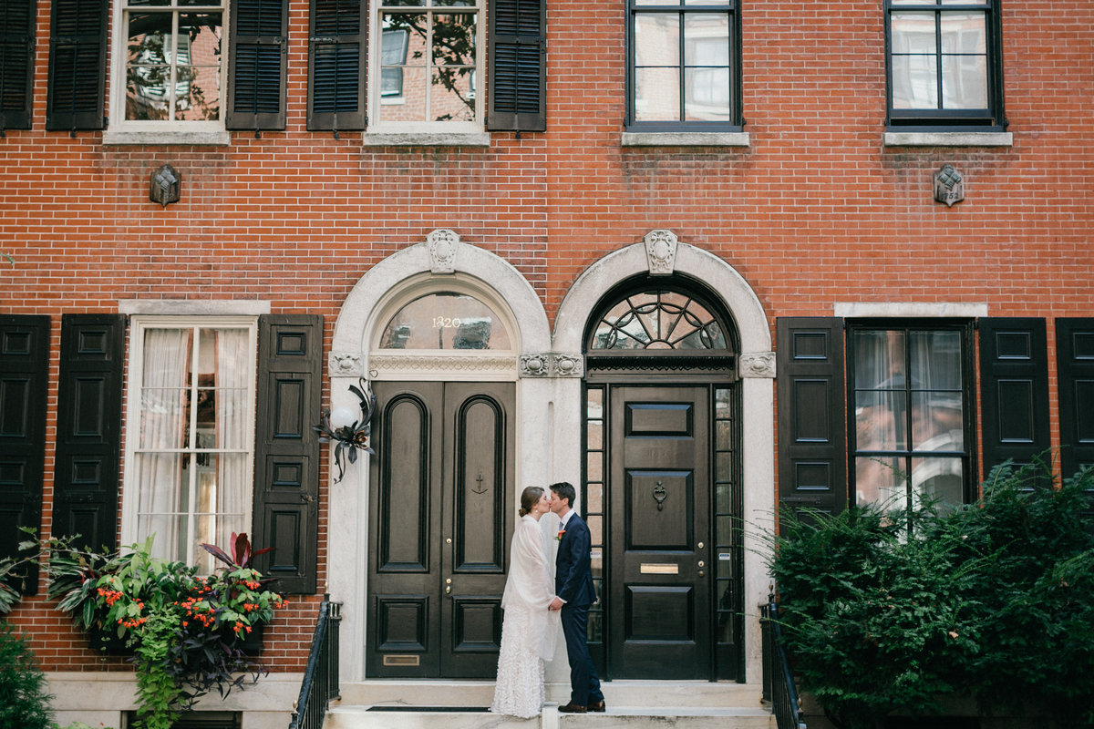 Philadelphia couple share a kiss in Rittenhouse after the wedding ceremony.