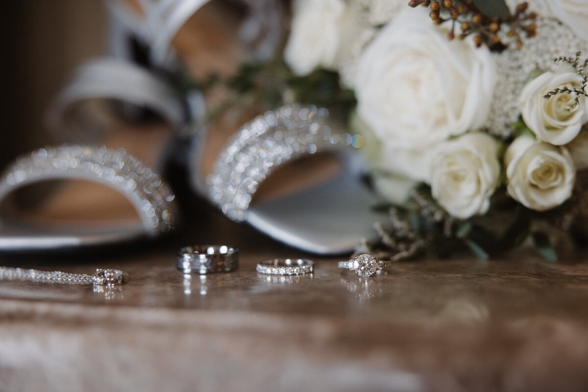 detail shot of brides shoes rings and flowers on wedding day in lancaster pa