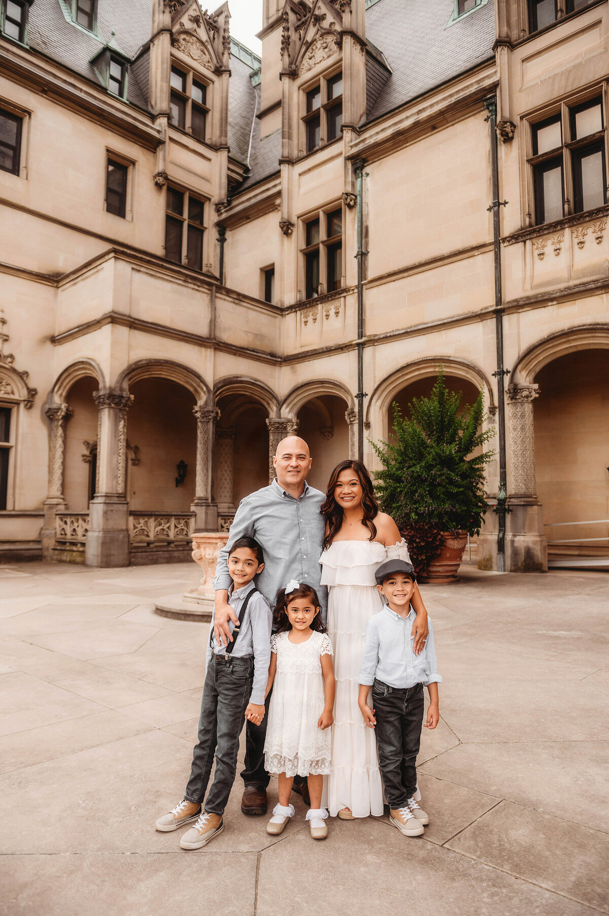 Family poses together for Family Pictures at Biltmore Estate in Asheville, NC.