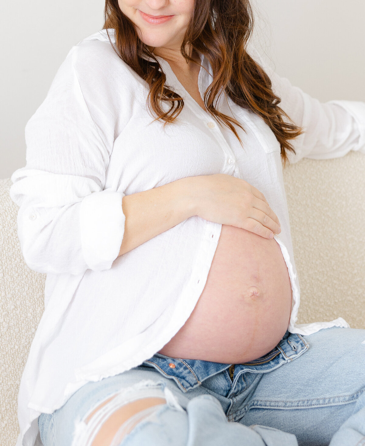 pregnancy photo of mom wearing simple white button down