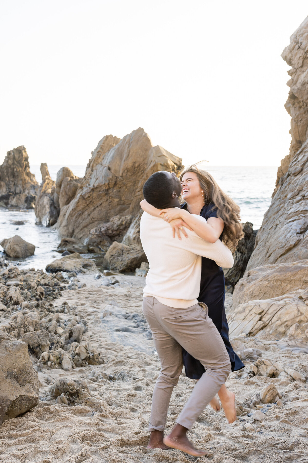 fun couple photoshoot on the beach
