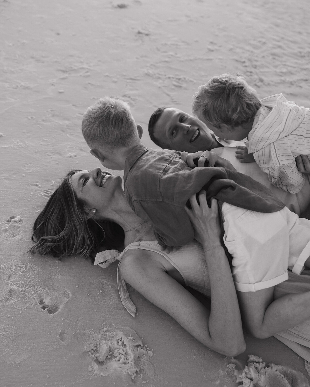 family plays on Seaside beach