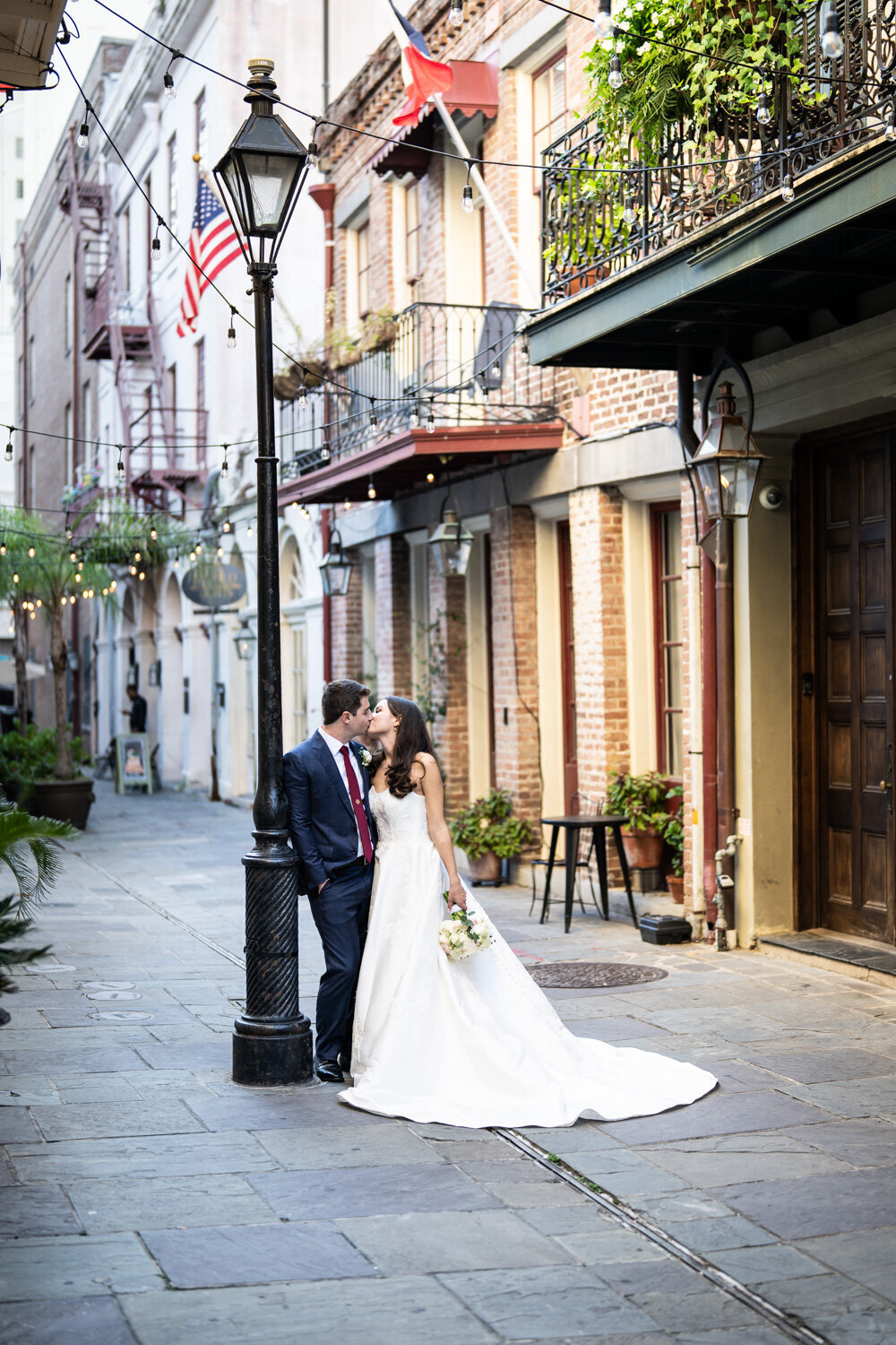 Bride and groom by lamp post in Exchange Place