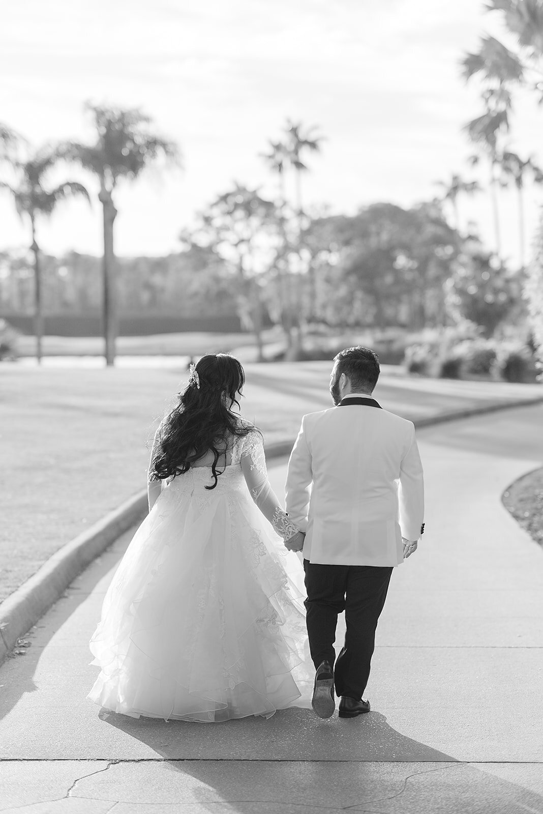 Bride and Groom walking into the sunset 