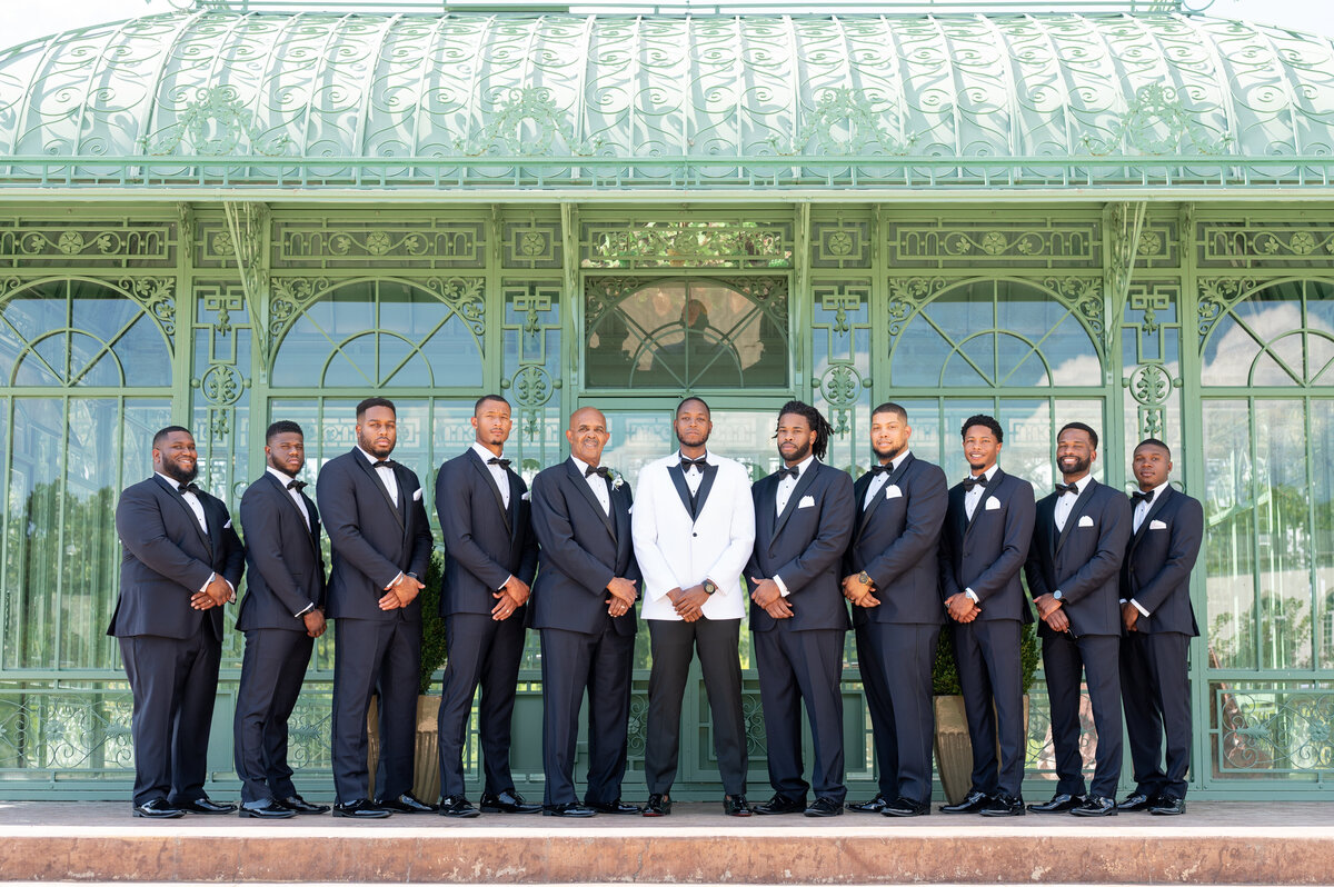 groom posing with groomsmen