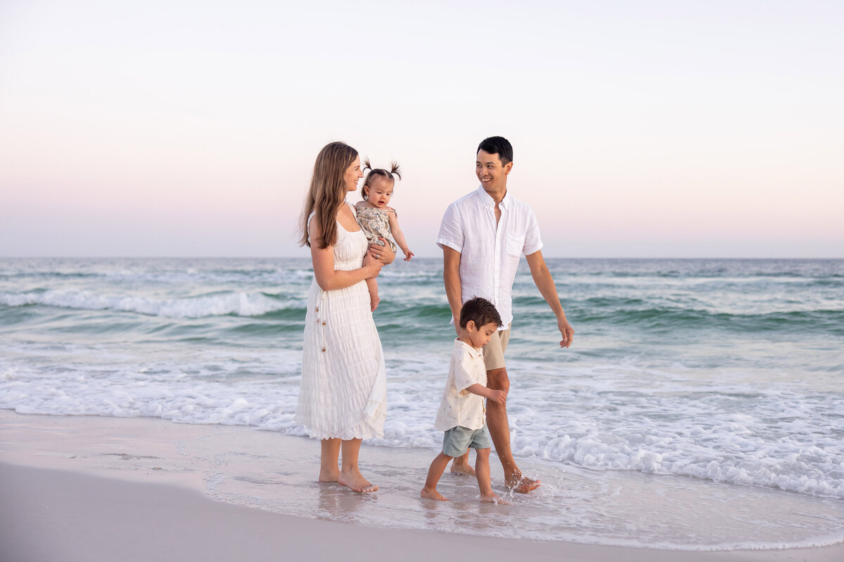 Family enjoying a beach photoshoot in Watercolor, Florida by 30A photographer Gwyne Gray"
