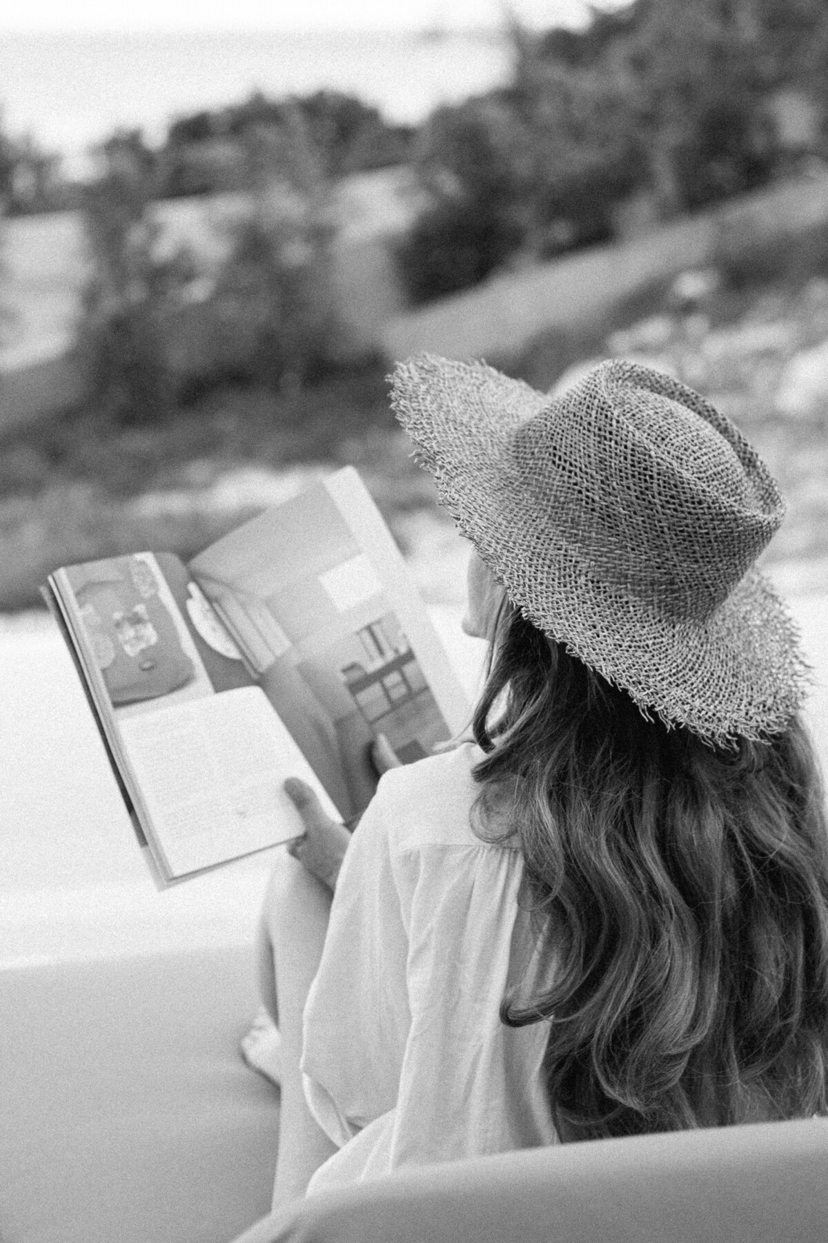 Woman reading a book at Pera Perou Villas, Kefalonia, Greece