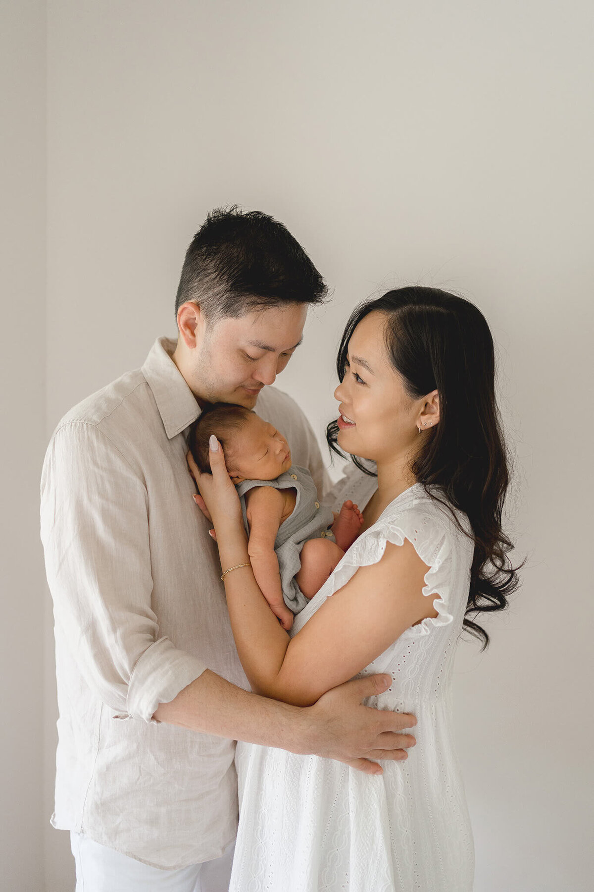Embrace the beauty of new life as a first-time Chinese mum and dad celebrate their newborn in stunning Gold Coast maternity photos