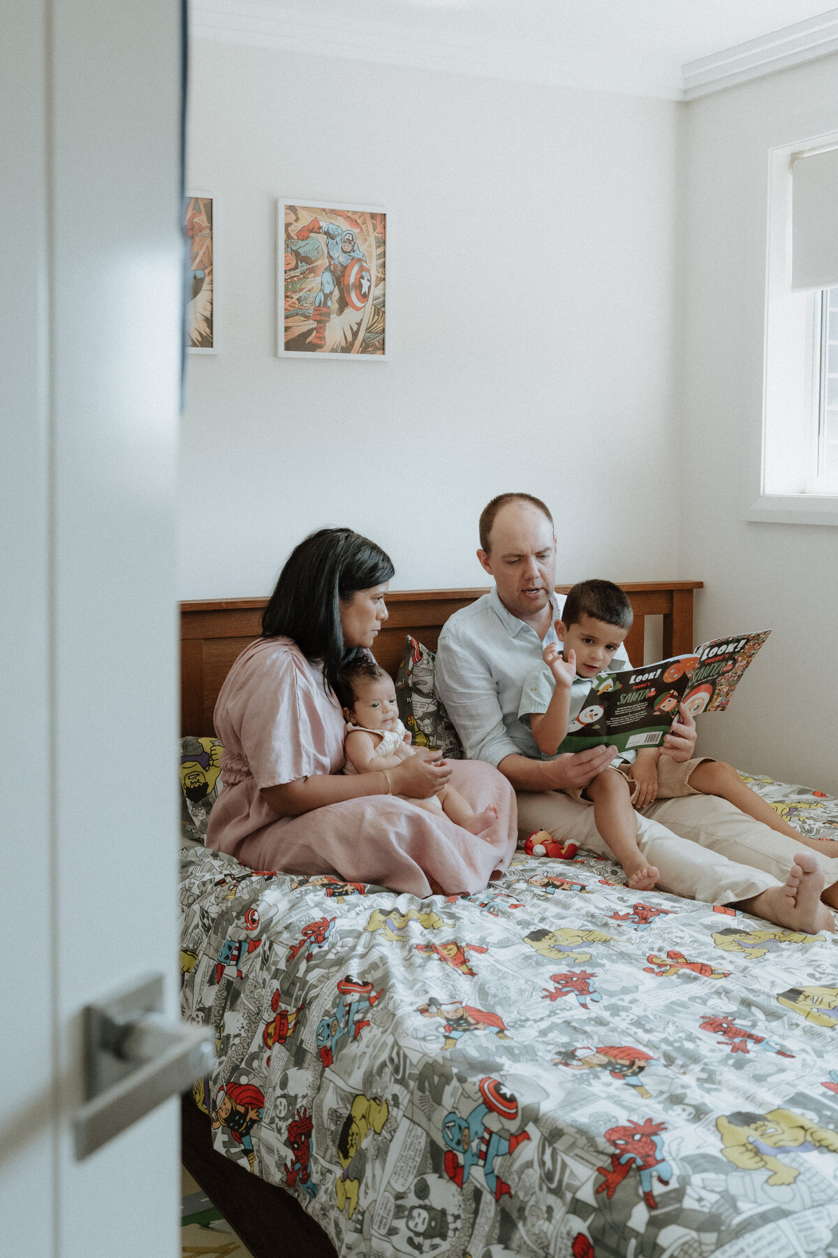 family reading together in child's bedroom