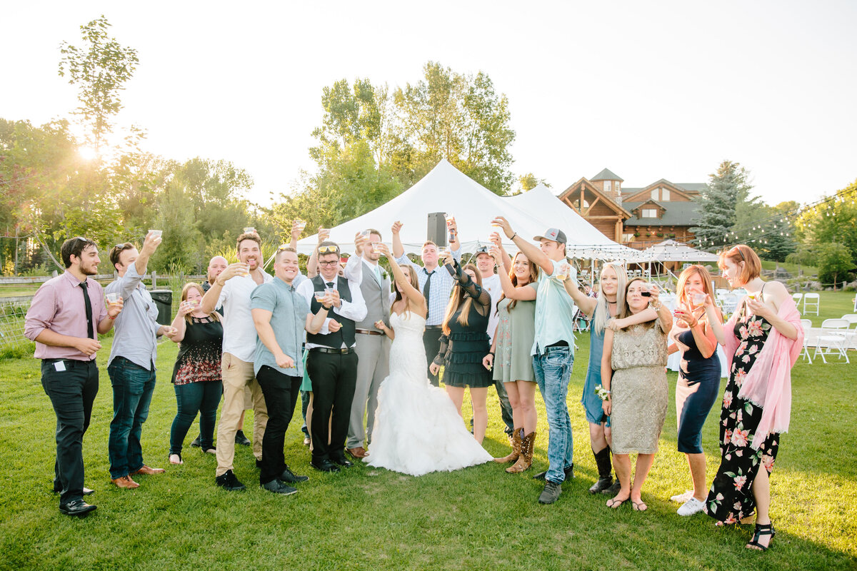 bride toasting labelle lake rigby wedding