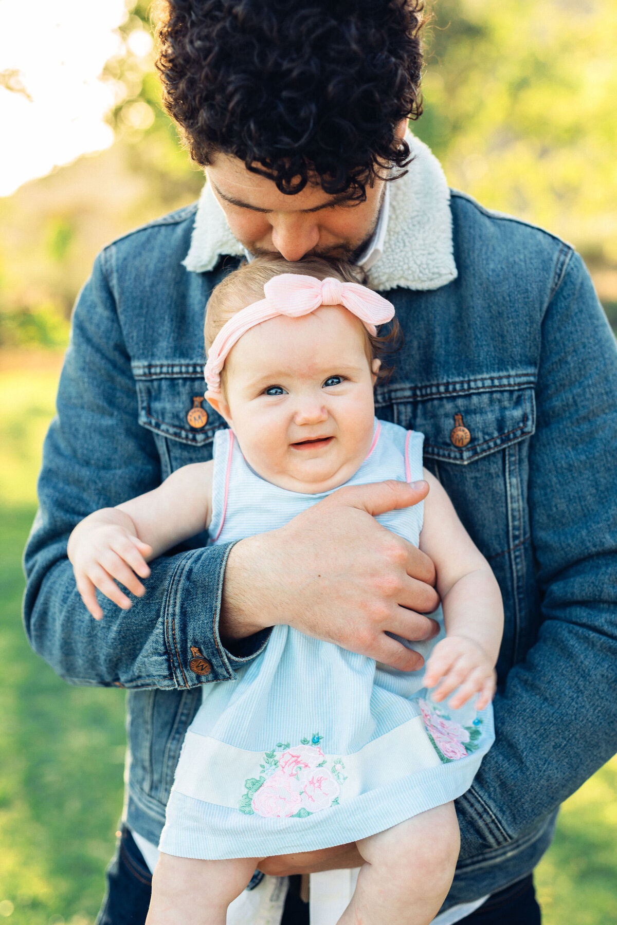 Family Portrait Photo Of Father Carrying a Baby Girl In Los Angeles