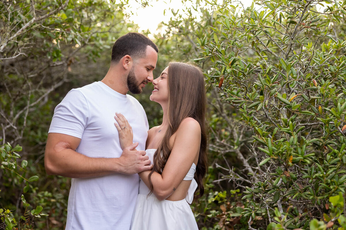 newly married couple honeymooning on 30a taking pictures at grayton beach state park.