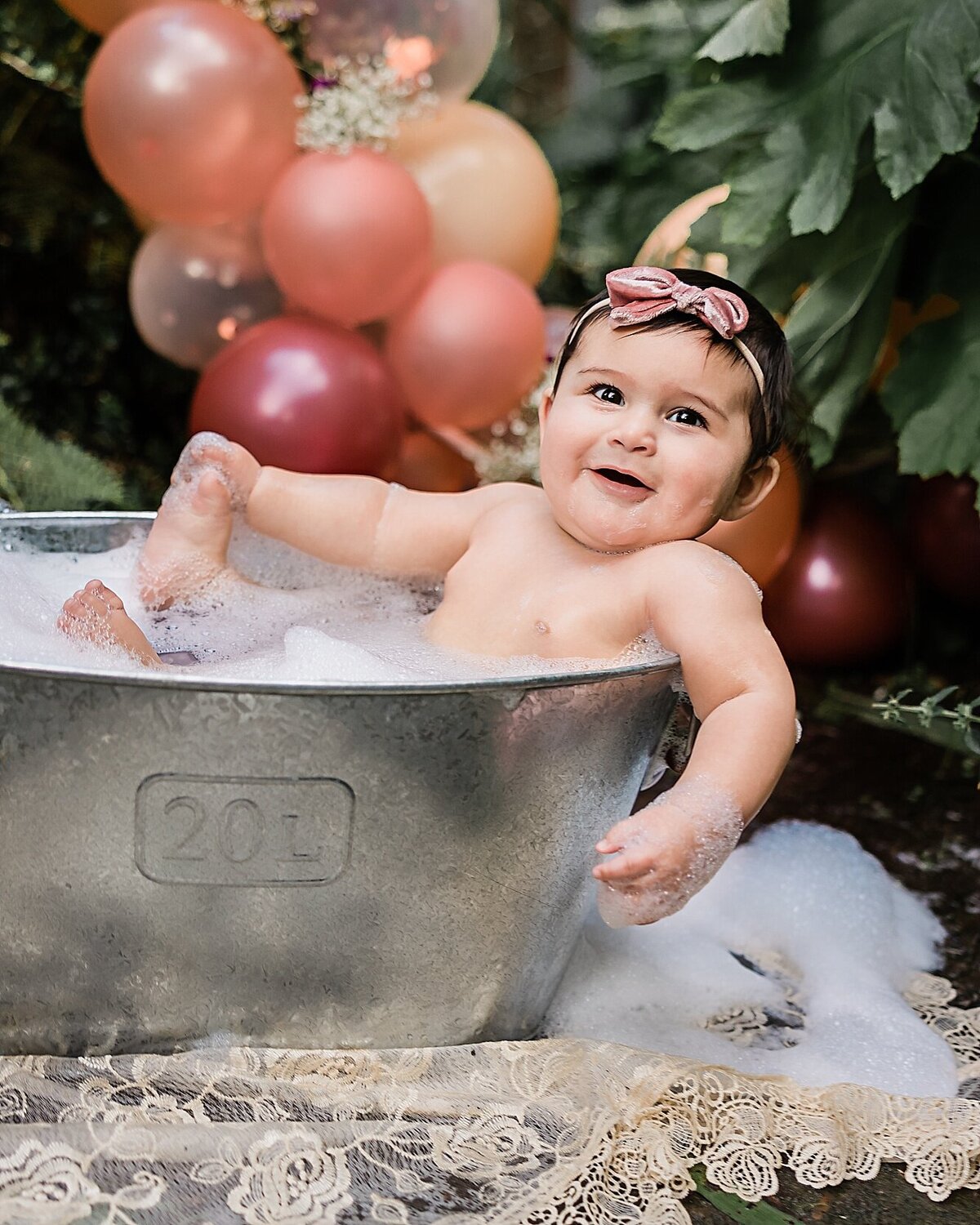 baby in bubble bath outdoors in summer