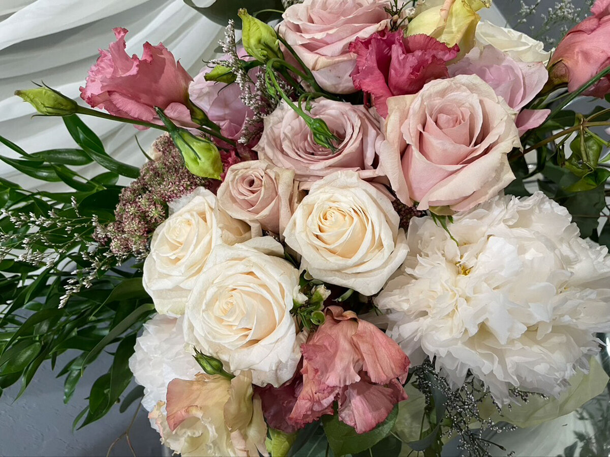 Romantic bouquet of roses, peonies, and greenery