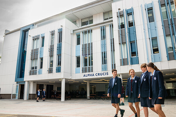 Students walking outside the newly constructed St Patrick’s College building in Sutherland, NSW — modern 5-storey education facility delivered by Serlana Construction