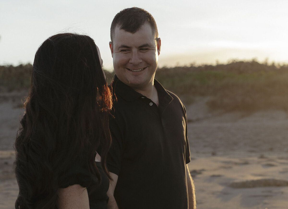 Man looking at woman and smiling