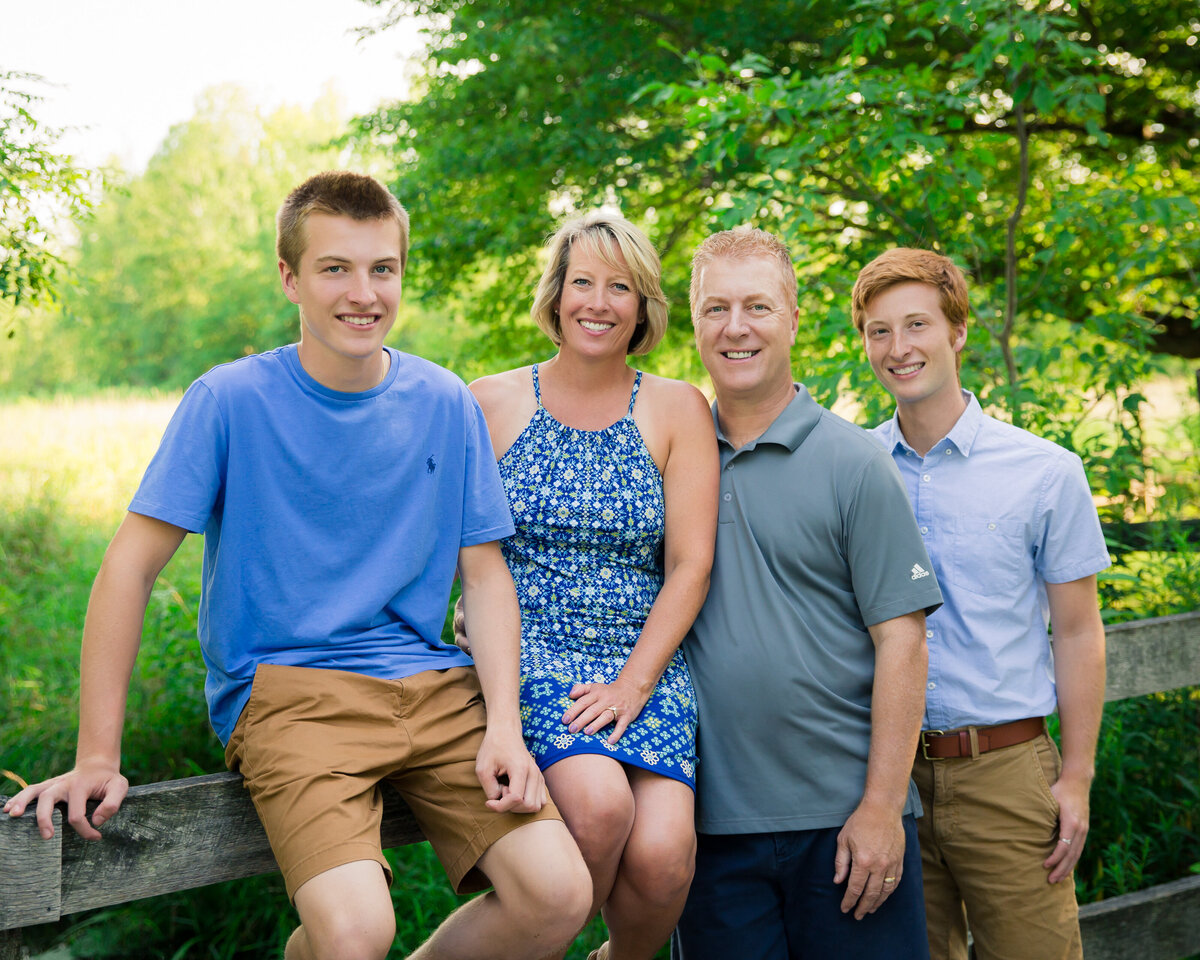 Two teenage boys and their parents. Portrait with greenery at farm location near Rochester, NY